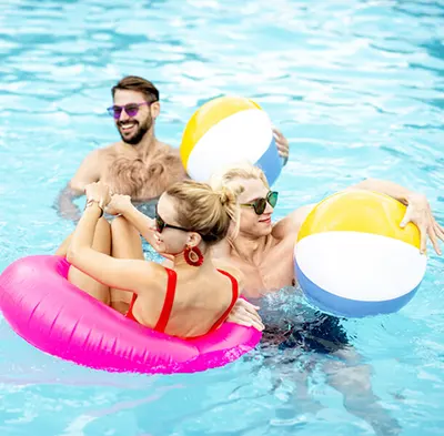 FAU students laughing in pool